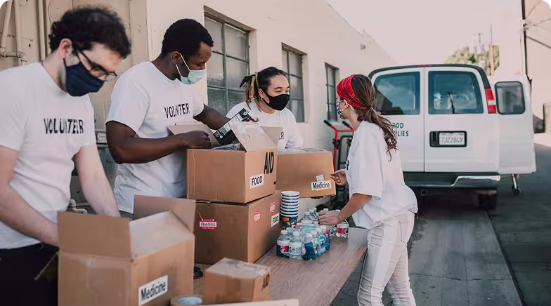Volunteers sorting donation boxes