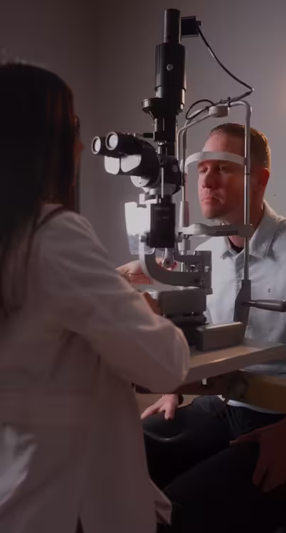 Man having his eyes examined by his doctor